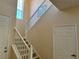 Carpeted staircase with white railings, leading to the upper level of the home at 5450 Watervista Dr, Orlando, FL 32821