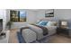 Cozy bedroom with bright window, stylish decor, and comfortable furnishings at 2205 Cypress Cove Dr, Tavares, FL 32778
