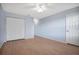 Spacious bedroom featuring ample closet space and a ceiling fan at 2205 Cypress Cove Dr, Tavares, FL 32778