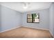 Bedroom featuring wood-look floors and a window offering natural light at 2205 Cypress Cove Dr, Tavares, FL 32778