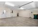 Clean garage with a door to the exterior and water heater at 2205 Cypress Cove Dr, Tavares, FL 32778