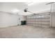 Spacious garage with an automatic door and space for storage at 2205 Cypress Cove Dr, Tavares, FL 32778