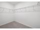 Spacious walk-in closet with carpet flooring and wire shelving for ample storage space at 4054 Serene Water Ave, Eustis, FL 32736
