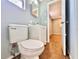 Bright bathroom featuring a modern toilet, vanity and fixtures, along with tile flooring at 544 S Cottage Hill Rd, Orlando, FL 32805
