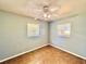 This is a bedroom featuring tile floors and two windows at 544 S Cottage Hill Rd, Orlando, FL 32805