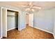Comfortable bedroom featuring tile flooring, a ceiling fan and closet for storage at 544 S Cottage Hill Rd, Orlando, FL 32805