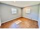 A bright bedroom featuring tile floors and two windows at 544 S Cottage Hill Rd, Orlando, FL 32805
