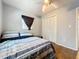 This cozy bedroom features tile floors, a ceiling fan, and a double door closet for storing your things at 544 S Cottage Hill Rd, Orlando, FL 32805