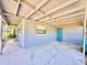 Enclosed carport featuring plenty of parking and additional room for storage or a workshop area at 544 S Cottage Hill Rd, Orlando, FL 32805