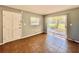 Clean, empty room with tile flooring, a window, and a door to the outside at 544 S Cottage Hill Rd, Orlando, FL 32805
