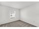 Bedroom showcasing neutral carpet, a window with blinds, and fresh white walls at 2633 Hancock Crossing Dr, Bartow, FL 33830