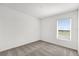 Neutral-toned bedroom with a window and carpeted floors, offering a serene and comfortable atmosphere at 2633 Hancock Crossing Dr, Bartow, FL 33830