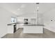 Spacious kitchen with stainless steel appliances, granite countertops, and a large center island at 2633 Hancock Crossing Dr, Bartow, FL 33830