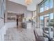 Bright, open living space with floor to ceiling windows and a modern kitchen featuring a beautiful chandelier at 322 E Central Blvd # 401, Orlando, FL 32801