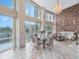 Well-lit living and dining area featuring large windows with beautiful views and modern decor at 322 E Central Blvd # 401, Orlando, FL 32801