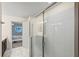 Walk-in shower with glass enclosure at 8831 Interlocking Ct, Davenport, FL 33896