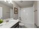 Clean bathroom with a tub, toilet and vanity at 8831 Interlocking Ct, Davenport, FL 33896