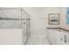 Bathroom with soaking tub and a walk-in shower at 8831 Interlocking Ct, Davenport, FL 33896
