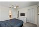 King-size bed, ceiling fan, and dresser at 8831 Interlocking Ct, Davenport, FL 33896