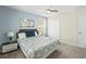 Bedroom with a queen-size bed and ceiling fan at 8831 Interlocking Ct, Davenport, FL 33896