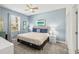 Bedroom with a king-size bed and ceiling fan at 8831 Interlocking Ct, Davenport, FL 33896
