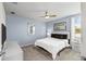 Spacious bedroom with a king-size bed and ceiling fan at 8831 Interlocking Ct, Davenport, FL 33896