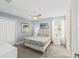Bedroom with a queen-size bed and ceiling fan at 8831 Interlocking Ct, Davenport, FL 33896