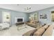 Bright and airy living room, neutrally decorated with large windows at 8831 Interlocking Ct, Davenport, FL 33896