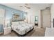 Large main bedroom with a king-size bed and ensuite bath at 8831 Interlocking Ct, Davenport, FL 33896