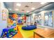 Colorful play area with toys and a comfy seating at 8831 Interlocking Ct, Davenport, FL 33896