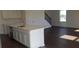 Kitchen island with a stainless steel sink and modern faucet, opening to the living area at 5583 Maddie Dr, Haines City, FL 33845