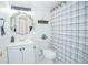 Clean bathroom with white vanity, shower/tub combo, and patterned curtain at 1048 Plantation Dr # E-9, Kissimmee, FL 34741