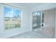Bedroom with sliding door to screened porch and view at 1048 Plantation Dr # E-9, Kissimmee, FL 34741