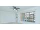 Bright bedroom with large window, ceiling fan, and view at 1048 Plantation Dr # E-9, Kissimmee, FL 34741