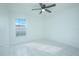 Well-lit bedroom featuring tile flooring and a ceiling fan at 1048 Plantation Dr # E-9, Kissimmee, FL 34741