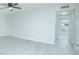 Living area with wood-look floors and access to other rooms at 1048 Plantation Dr # E-9, Kissimmee, FL 34741