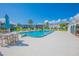 Refreshing community pool, surrounded by patio furniture at 1048 Plantation Dr # E-9, Kissimmee, FL 34741