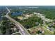 Community overview featuring homes, roads, and a lake at 124 Lake Dr, Oviedo, FL 32765