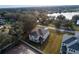 Aerial view of two-story house with backyard, lake, and neighborhood at 124 Lake Dr, Oviedo, FL 32765