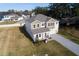 Aerial view of two-story house with landscaped yard and driveway at 124 Lake Dr, Oviedo, FL 32765