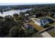 Aerial view of lakefront neighborhood with several houses at 124 Lake Dr, Oviedo, FL 32765