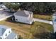 Two-story home with gray exterior and paver driveway at 124 Lake Dr, Oviedo, FL 32765