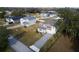 Aerial view of neighborhood with several houses and tree-lined streets at 124 Lake Dr, Oviedo, FL 32765