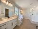 Spacious bathroom with double vanity, soaking tub, and a walk-in shower at 124 Lake Dr, Oviedo, FL 32765