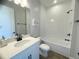 Clean bathroom with tub shower combo and white subway tiles at 124 Lake Dr, Oviedo, FL 32765