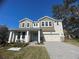 Beautiful two story home with a landscaped yard and driveway at 124 Lake Dr, Oviedo, FL 32765