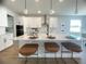 Modern kitchen island with white cabinets and quartz countertop at 124 Lake Dr, Oviedo, FL 32765