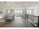 Large loft with hardwood floors, offering versatile living space at 124 Lake Dr, Oviedo, FL 32765