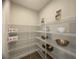 Walk-in pantry with wire shelving, offering lots of storage space at 124 Lake Dr, Oviedo, FL 32765