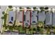 Aerial view of a home with solar panels, a green backyard, and a well-maintained roof and lawn at 4904 W Fountainwood Dr, St Cloud, FL 34772